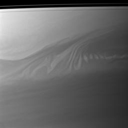 Clouds in Saturn's atmosphere create an intricate pattern reminiscent of whipped cream swirling in coffee in this image captured by NASA's Cassini spacecraft.