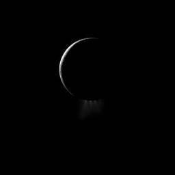 A crescent Enceladus, imaged by NASA's Cassini spacecraft from the night side, shows off its spectacular water ice plumes emanating from the south polar region of this moon of Saturn.
