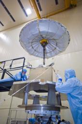 Assembly began April 1, 2010, for NASA's Juno spacecraft in the high-bay cleanroom at Lockheed Martin in Denver, Colo. Workers are moving the radiation vault above a mock-up of the upper part of the spacecraft's main body.
