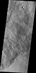 This image taken by NASA's 2001 Mars Odyssey shows the southeastern flank of Hecates Tholus, the northernmost volcano of the Elysium Volcanic complex.