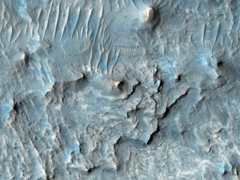 Ius Chasma is one of several canyons that make up Valles Marineris, the largest canyon system in the Solar System as seen by NASA's Mars Reconnaissance Orbiter.