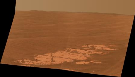 NASA's Mars Exploration Rover Opportunity used its panoramic camera (Pancam) to capture this view approximately true-color view of the rim of Endeavour crater, the rover's destination in a multi-year traverse along the sandy Martian landscape.