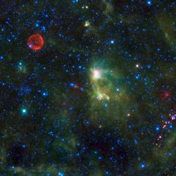 This image from NASA's Wide-field Infrared Survey Explorer takes in several interesting objects in the constellation Cassiopeia which are not easily seen in visible light. The red circle visible at upper left is SN 1572, often called Tycho's Supernova.