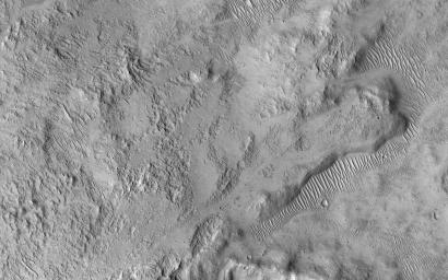NASA's Mars Reconnaissance Orbiter spied this small 2 kilometer-wide crater when a meteoroid struck the ground just to the west and created a new, larger crater (not shown).