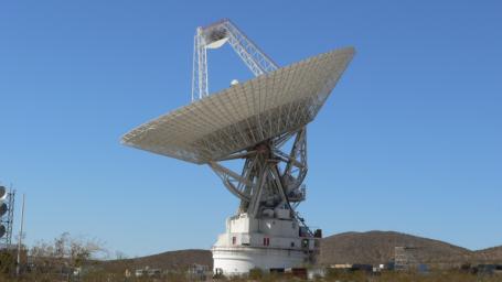 The giant, 70-meter-wide antenna at NASA's Deep Space Network complex in Goldstone, Calif., tracks a spacecraft on Nov. 17, 2009. This antenna, officially known as Deep Space Station 14, is also nicknamed the 'Mars antenna.'