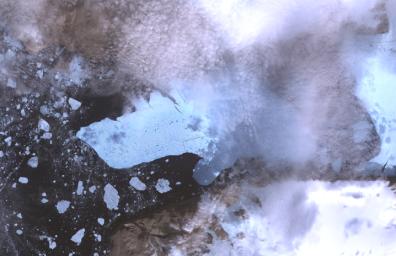 This image of Petermann Glacier and the new iceberg was acquired from NASA's Terra spacecraft on Aug. 12, 2010. On Aug. 5, 2010, an enormous chunk of ice broke off the Petermann Glacier along the northwestern coast of Greenland.