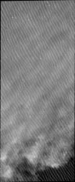 Clouds are common near the north polar caps throughout the spring and summer. The clouds typically cause a haze over the extensive dune fields. This image from NASA's Mars Odyssey shows the edge of the cloud front.