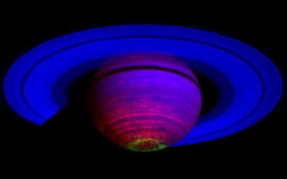This false-color composite image, constructed from data obtained by NASA's Cassini spacecraft, shows the glow of auroras streaking out about 1,000 kilometers (600 miles) from the cloud tops of Saturn's south polar region.
