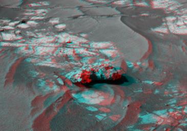 An iron meteorite is the latest quarry for NASA's Mars Exploration Rover Opportunity. Shown here is the left-eye view of a stereo pair of images. 3D glasses are necessary to view this image.