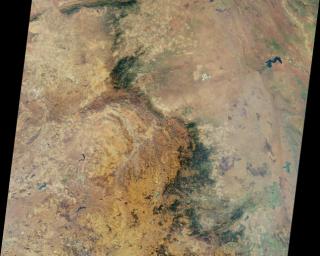 This nadir camera view was captured by NASA's Terra spacecraft around Kruger National Park in NE South Africa. The bright white feature is the Palabora Copper Mine, and the water body near upper right is Lake Massingir in Mozambique.