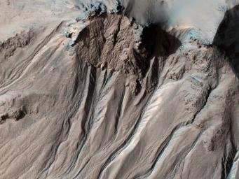 This image from NASA's Mars Reconnaissance Orbiter shows the southern latitude Hale Crater, a rather large, pristine elliptical crater possessing sharp features, impact melt bodies ponded throughout the structure and few overprinting impact craters.