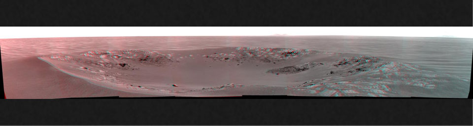 'Intrepid' crater on Mars carries the name of the lunar module of NASA's Apollo 12 mission, which landed on Earth's moon Nov. 19, 1969. NASA's Mars Exploration Rover Opportunity recorded this stereo view on Nov. 11, 2010. 3D glasses are necessary.