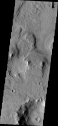 This image from NASA's Mars Odyssey shows layered material surrounding an unnamed crater in Terra Sabaea.