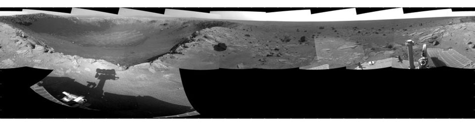 This 360-degree mosaic of images from the navigation camera on NASA's Mars Exploration Rover Opportunity shows the view from the western rim of 'Santa Maria' crater. South is at the center, north at both ends.