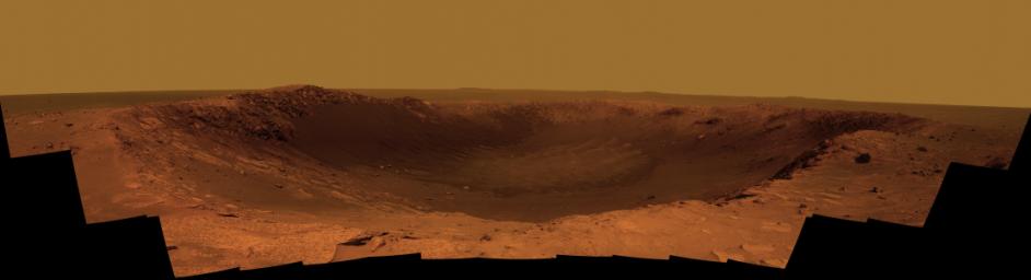 NASA's Mars Exploration Rover Opportunity is spending the seventh anniversary of its landing on Mars investigating a crater called 'Santa Maria,' which has a diameter about the length of a football field. This scene looks eastward across the crater.