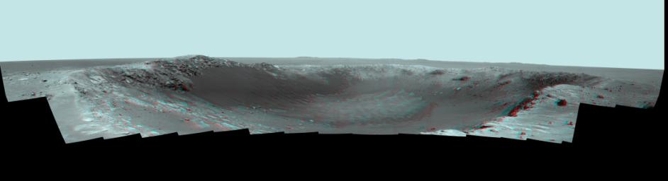 NASA's Mars Exploration Rover Opportunity spent the seventh anniversary of its landing on Mars investigating a crater called 'Santa Maria,' which has a diameter about the length of a football field. 3D glasses are necessary to view this image.