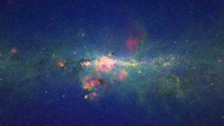 A view from the bustling center of our galactic metropolis. NASA's Spitzer Space Telescope offers a fresh, infrared view of the frenzied scene at the center of our Milky Way, revealing what lies behind the dust.