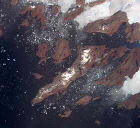 Acquired by NASA's Terra spacecraft, this image shows the west coast of Greenland, one of Earth's premiere incubators for icebergs -- large blocks of land ice that break off from glaciers or ice shelves and float in the ocean.