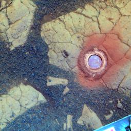 NASA's Mars Exploration Rover Opportunity used its rock abrasion tool on a rock informally named 'Gagarin.' This false-color image shows the circular mark created where the tool exposed the interior of the rock at a target called 'Yuri.'