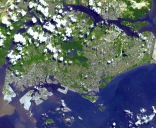 This image from NASA's Terra spacecraft is of the Republic of Singapore, a city-state off the southern tip of the Malay Peninsula. An island country made up of 63 islands, the country is largely urbanized with very little rain forest left.