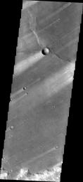 This image from NASA's 2001 Mars Odyssey shows windstreaks mark the plains of northern Terra Sabaea.