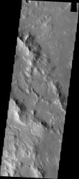 Small channels dissect the rim of Bakhuysen Crater in Noachis Terra as seen by NASA's 2001 Mars Odyssey.