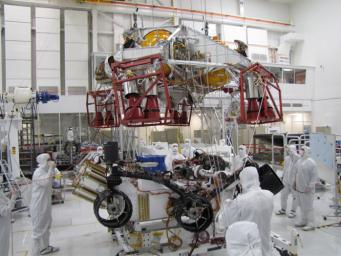 Spacecraft specialists test the descent stage and rover of the Mars Science Laboratory in this scene from the Spacecraft Assembly Facility at NASA's Jet Propulsion Laboratory, Pasadena, Calif.