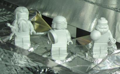 Three LEGO figurines representing the Roman god Jupiter, his wife Juno and Galileo Galilei are shown here aboard the Juno spacecraft.