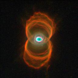 This Hubble telescope snapshot of MyCn18, a young planetary nebula, reveals that the object has an hourglass shape with an intricate pattern of 'etchings' in its walls. A planetary nebula is the glowing relic of a dying, Sun-like star.