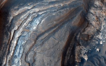 Over 300 meters of layered beds are exposed in this trough of Noctis Labyrinthus, at the western edge of Valles Marineris, as observed by NASA's Mars Reconnaissance Orbiter.