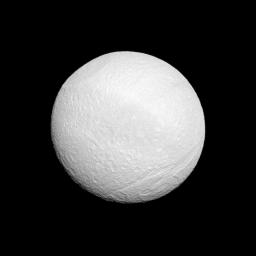 Saturn's moon Tethys shows off its tortured surface in this image from NASA's Cassini spacecraft. At top left of image is huge Odysseus Crater. At bottom right is Ithaca Chasma, a series of scarps that runs north-south across the moon.
