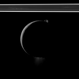 During a flyby of Saturn's moon Enceladus on Oct. 1, 2011, NASA's Cassini spacecraft snapped this portrait of the moon joined by its sibling Epimetheus and the planet's rings.