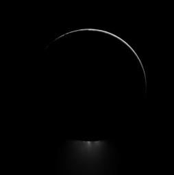 Below a darkened Enceladus, a plume of water ice is backlit in this view of one of Saturn's most dramatic moons. This image was captured by NASA's Cassini spacecraft.