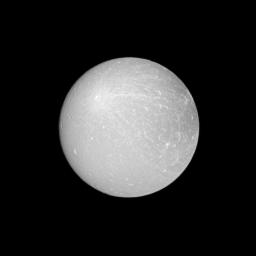 NASA's Cassini spacecraft looks at an example of a ray crater on the leading hemisphere of Saturn's moon Dione. The ray crater is in the upper-left of the image and ejecta rays show up as brighter material emanating from the crater.