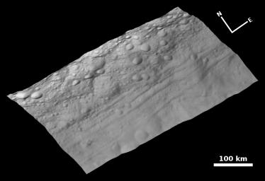 This view of the topography of asteroid Vesta's surface is composed of several images obtained with the clear filter in the framing camera on NASA's Dawn spacecraft on August 6, 2011. The image has a resolution of about 260 meters per pixel.