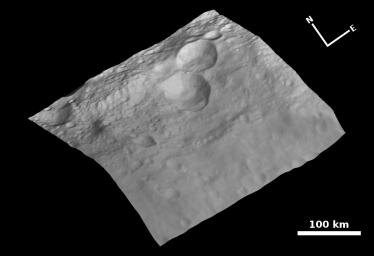 This view of the topography of asteroid Vesta's surface is composed of several images obtained with the framing camera on NASA's Dawn spacecraft on August 6, 2011. The image mosaic is shown superimposed on a digital terrain model.