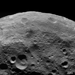 NASA's Dawn spacecraft obtained this image of dark material on hilltops on asteroid Vesta with its framing camera on August 18, 2011. The image has a resolution of about 260 meters per pixel.