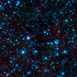 NASA's Wide-field Infrared Survey Explorer has uncovered the coldest brown dwarf known so far (green dot in very center of this infrared image). WISE 1828+2650 is located in the constellation Lyra. The blue dots are a mix of stars and galaxies.