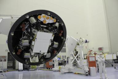 At the Payload Hazardous Servicing Facility at NASA's Kennedy Space Center in Florida, the 'back shell powered descent vehicle' configuration of NASA's Mars Science Laboratory is being rotated for final closeout actions.