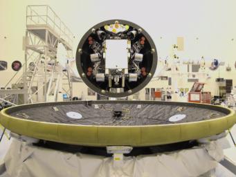At the Payload Hazardous Servicing Facility at NASA's Kennedy Space Center in Florida, the 'back shell powered descent vehicle' configuration of NASA's Mars Science Laboratory is being rotated for final closeout actions.