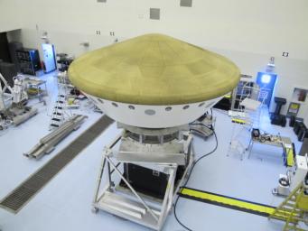 At the Payload Hazardous Servicing Facility at NASA's Kennedy Space Center in Florida, the Mars Science Laboratory rover, Curiosity, and the spacecraft's descent stage have been enclosed inside the spacecraft's aeroshell.