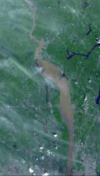 Brown and tan muddy water flows down the Hudson River are seen in this image acquired by NASA's Terra spacecraft on Sept. 1, 2011. After the torrential rains from Hurricane Irene, many rivers in the eastern United States were filled with sediment.