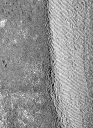 The eastern margin of a rippled dune in Herschel Crater on Mars moved an average distance of three meters (about three yards) between March 3, 2007 and December 1, 2010, in one of two images taken by NASA's Mars Reconnaissance Orbiter.