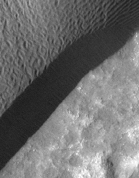 A rippled dune front in Herschel Crater on Mars moved an average of about one meter (about one yard) between March 3, 2007 and December 1, 2010, as seen in one of two images from NASA's Mars Reconnaissance Orbiter.