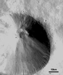 This image from NASA's Dawn spacecraft shows a fresh scarp rimmed crater with many boulders on asteroid Vesta's crater floor. These boulders have diameters of 100-200m, which is roughly the size of many asteroids.