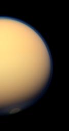 The recently formed south polar vortex stands out in the color-swaddled atmosphere of Saturn's largest moon, Titan, in this natural color view from NASA's Cassini spacecraft.