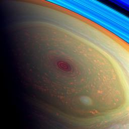 This spectacular, vertigo inducing, false-color image from NASA's Cassini mission highlights the storms at Saturn's north pole. The angry eye of a hurricane-like storm appears dark red.