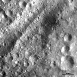 This closeup of asteroid Vesta from NASA's Dawn spacecraft shows small scale features such as grabens (linear depressions) which run parallel to and inside the troughs.