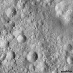 This image from NASA's Dawn spacecraft shows small rilles (scars) on asteroid Vesta's surface, mostly concentrated in the right half image, presumably due to impacts throwing out boulders, which crash across the surface scouring the rilles as they go.