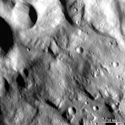 This image from NASA's Dawn spacecraft shows the hummocky (wavy/undulating) terrain of Vesta's Rheasilvia quadrangle, which is the south polar region.